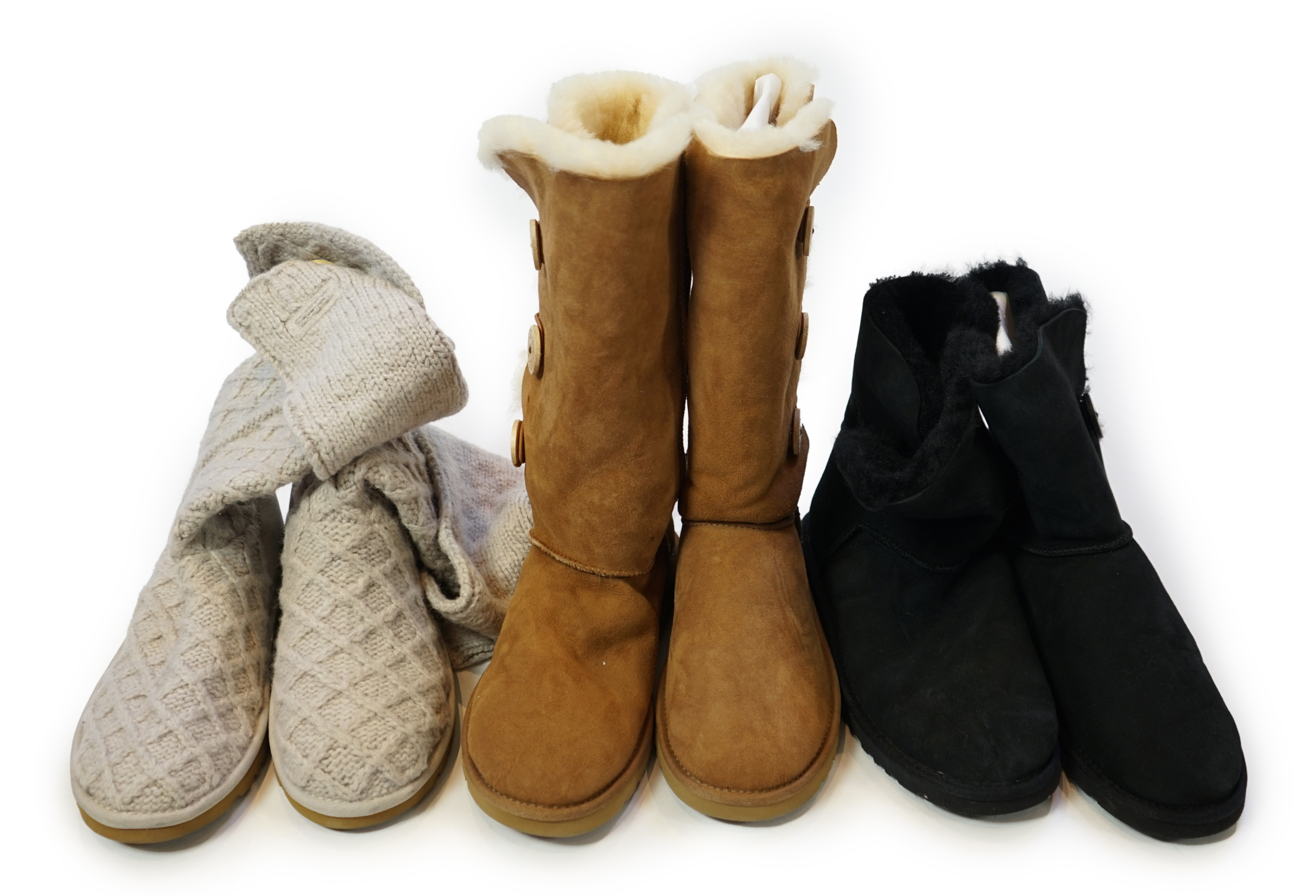 Three pairs of lady's low/mid height UGG sheepskin boots with side button design, size UK 7.5